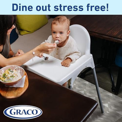 Rolling up a used disposable baby placemat for quick and easy clean up after dinner