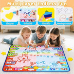 Toddlers using the water doodle mat showing neon drawings appearing on the white canvas area