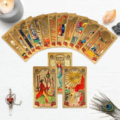 Hand holding a fan of KIINO gold foil tarot cards