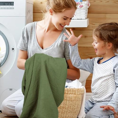 Pet Rejoir baby changing sheets being folded to demonstrate soft material quality.