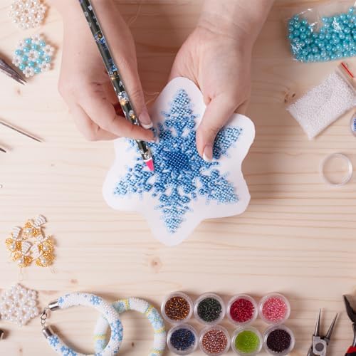 Hariendny gem pick up tools pack of four spread out neatly on a crafting mat with flatback crystals.