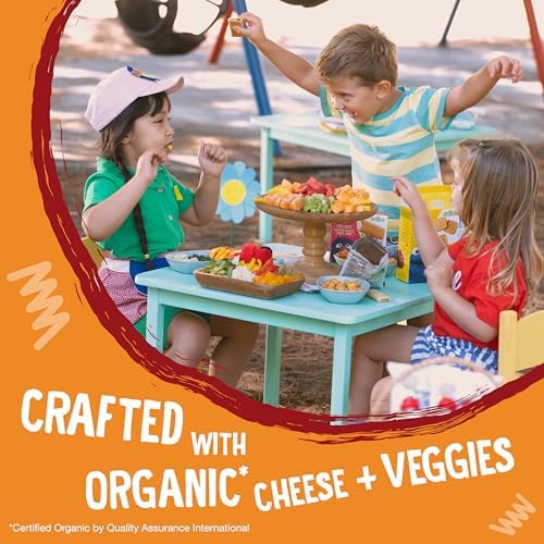 Close up view of light and airy organic cheese puffed snacks for toddlers