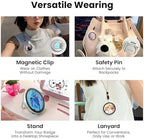 Pin Tura wearable digital badge displaying personal photo artwork via smartphone Bluetooth app control.