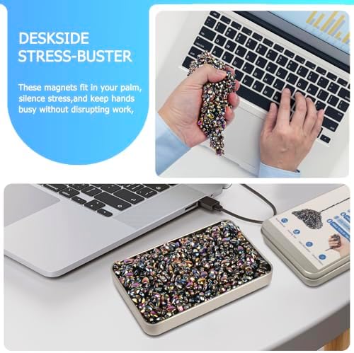 Adult hand sculpting and mashing the colorful sensory pebbles for office stress relief