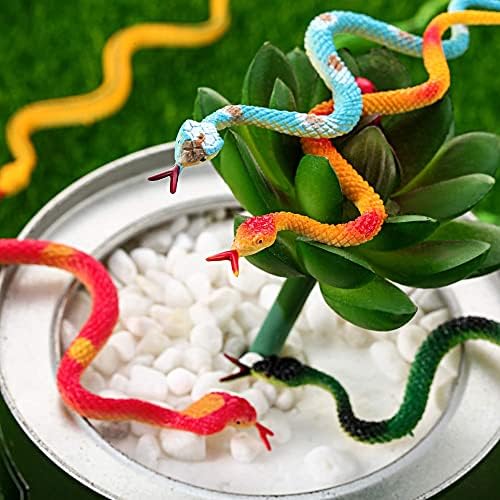 Blulu small plastic snakes arranged as spooky props for a Halloween themed party decoration setup.