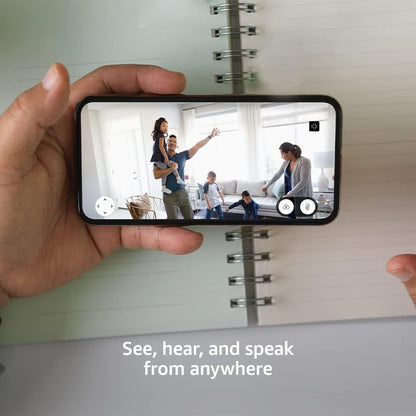 Blink smart home surveillance device positioned on a living room shelf