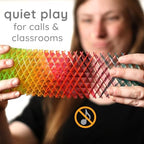 Teenager using the quiet Morf stress relief toy inside a library setting for focus