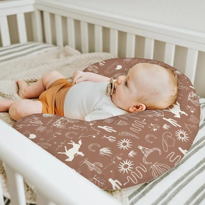Close up of cowboy themed print on baby nursing pillow