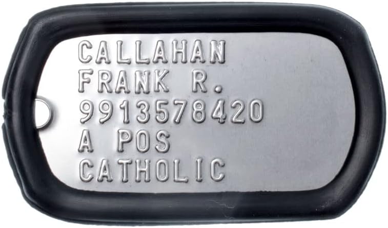 Close up view of raised embossed lettering on official military specification replacement tags.