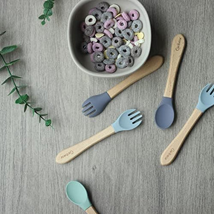 Toddler using Ginbear silicone spoon for self-feeding