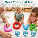 A toddler safely interacting with non-toxic flexible plastic pop tubes under adult supervision.