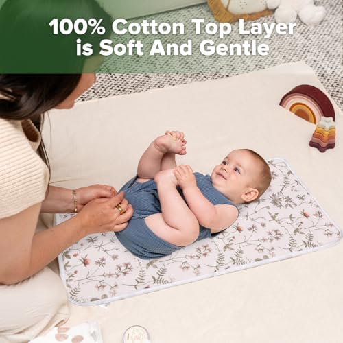 Haakaa cotton changing pad liner displayed on a flat surface