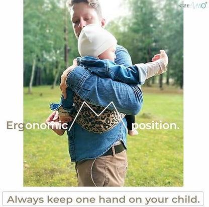Ergonomic hip seat carrier showing soft cotton shell texture.