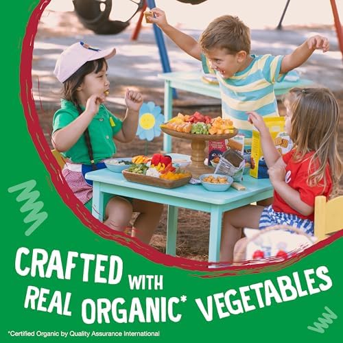 Gluten free organic potato and spinach snack straws poured out into a colorful toddler bowl