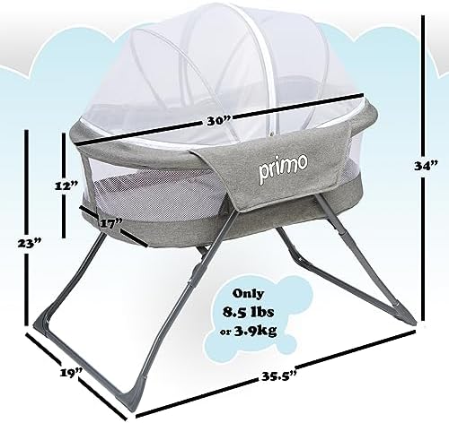 Close up view of the firm oval mattress pad inside the PRIMO travel crib.