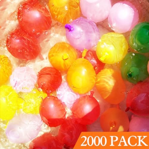 Vibrant assortment of inflated blue green pink yellow and orange backyard party water bombs