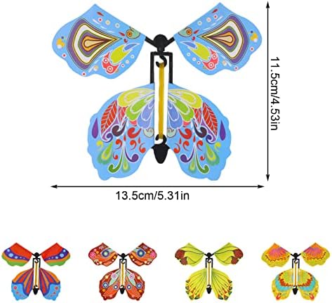 Close up of a hand winding the rubber band mechanism on the wind up butterfly toy