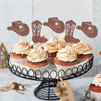 Zhuoweism cowboy cake decorations displayed on a tray of cupcakes.