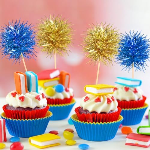 Firework cupcake toppers arranged for a birthday party setup