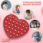 Washable silicone heart pop it toy displaying letters for classroom prizes