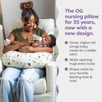 Parent using Boppy nursing pillow for bottle feeding