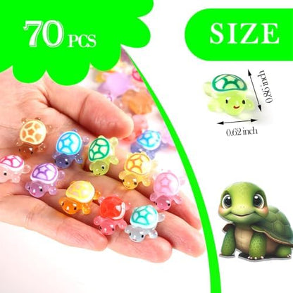 Glow in the dark mini resin turtles illuminating in a dark room setting to showcase phosphorescent features