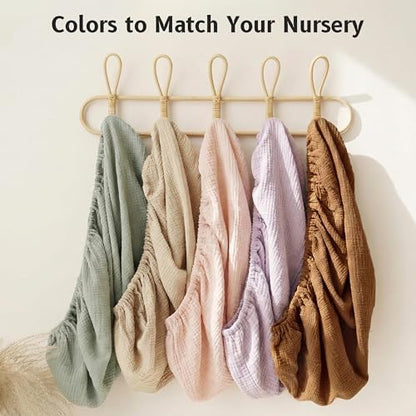Pro Goleem beige soft breathable cotton changing sheet demonstrating fabric elasticity and stretch.