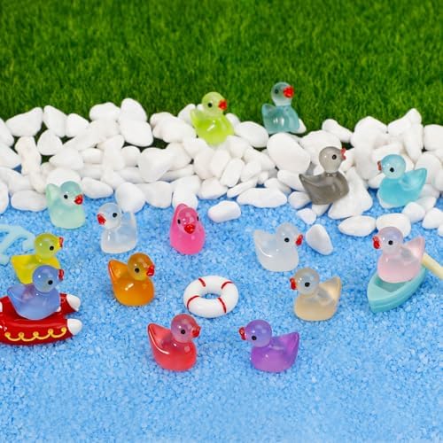 JYXT luminous plastic ducks glowing vividly in a dark room environment.