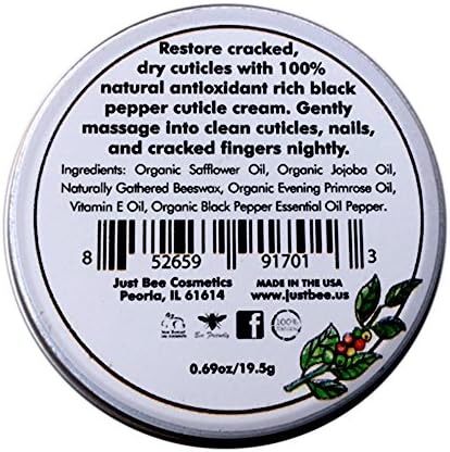 Applying Just Bee cuticle cream to fingernails