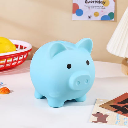 PandaEar cute blue plastic pig money box placed on a children's bedroom shelf as decor.