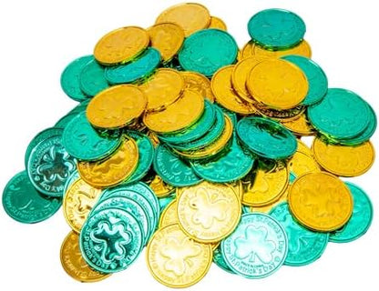 Embossed green and gold Irish themed treasure hunt tokens held in hand for scale