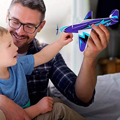 Joygogo toy glider plane performing aerodynamic loop stunts and distance flying in an open backyard setting.