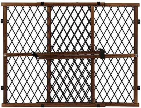 Evenflo adjustable wood pet and child gate expanded to fit a wide hallway opening.