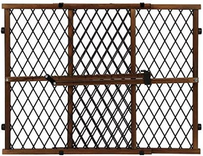 Evenflo adjustable wood pet and child gate expanded to fit a wide hallway opening.
