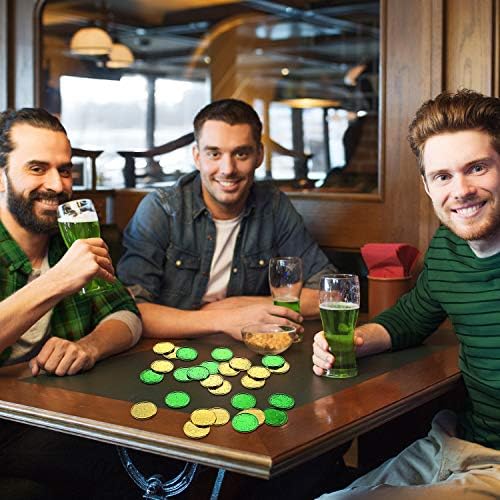 Assorted green and gold clover coin decorations displaying their lightweight plastic material.