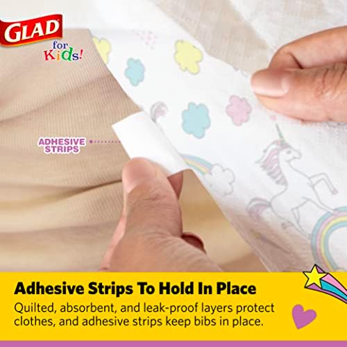 Toddler using Glad for Kids unicorn paper bib during meal