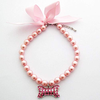 PetFavorites fancy pearls crystal dog necklace front view featuring pink ribbon bow and rhinestone bone charm.