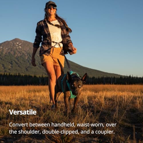 Lifestyle shot of dog owner using Ruffwear Switchbak leash outdoors