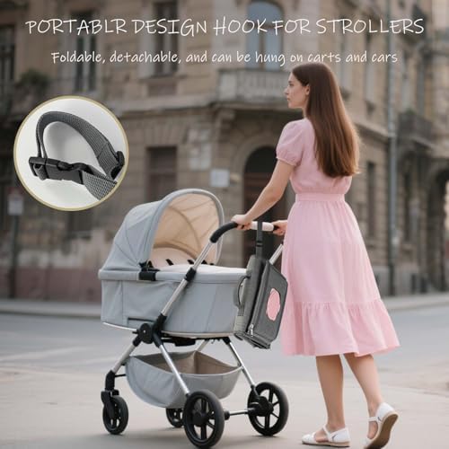 Kopi Baby grey changing pad attached to a stroller handlebar using its built-in travel straps