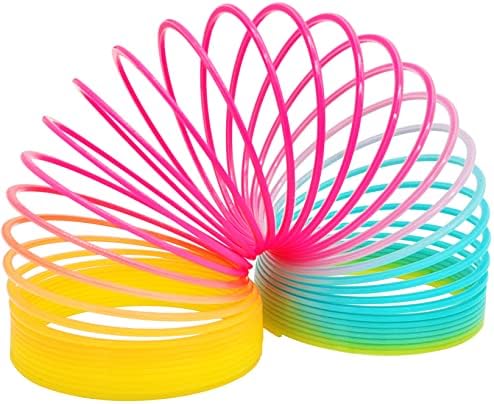 Bright rainbow colored plastic coil toy positioned at the top of stairs for stepping action