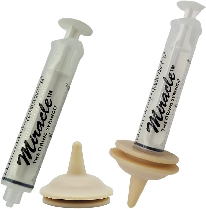 Authentic USA imported Miracle Nipple with O ring syringe attached for controlled puppy feeding.