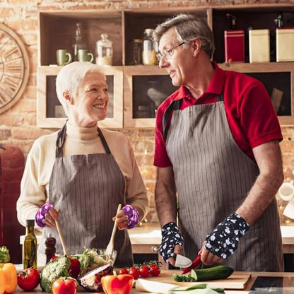 Elderly person wearing floral fingerless gloves while performing daily tasks.