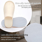 Six pairs of gray unisex spa slippers in travel bag