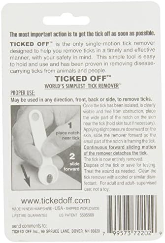 Ticked Off tick remover being held for demonstration