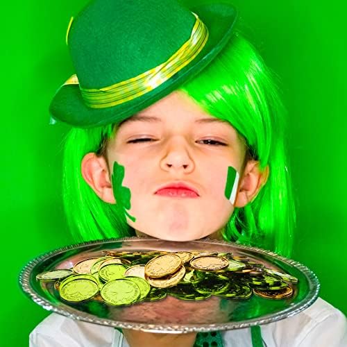 Clear glass vase filled with green and gold Civaner shamrock coins as a centerpiece.