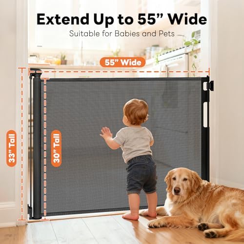 Black mesh dog gate extended across the bottom of a wooden staircase for pet safety