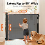 Black mesh dog gate extended across the bottom of a wooden staircase for pet safety