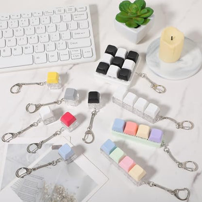 Complete ten piece collection of Kifmurase fidget clickers unboxed and ready for office desk organization.