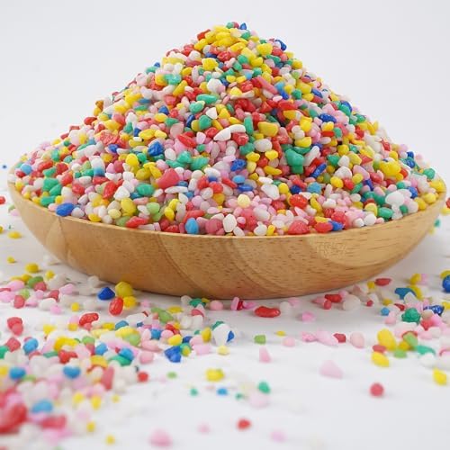Vibrant decorative pebbles in a glass fish tank