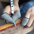 Grey fabric anti slip finger covers used for kitchen cutting safety
